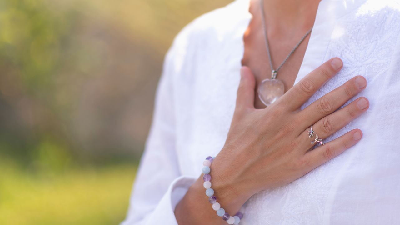 woman with hand over her heart