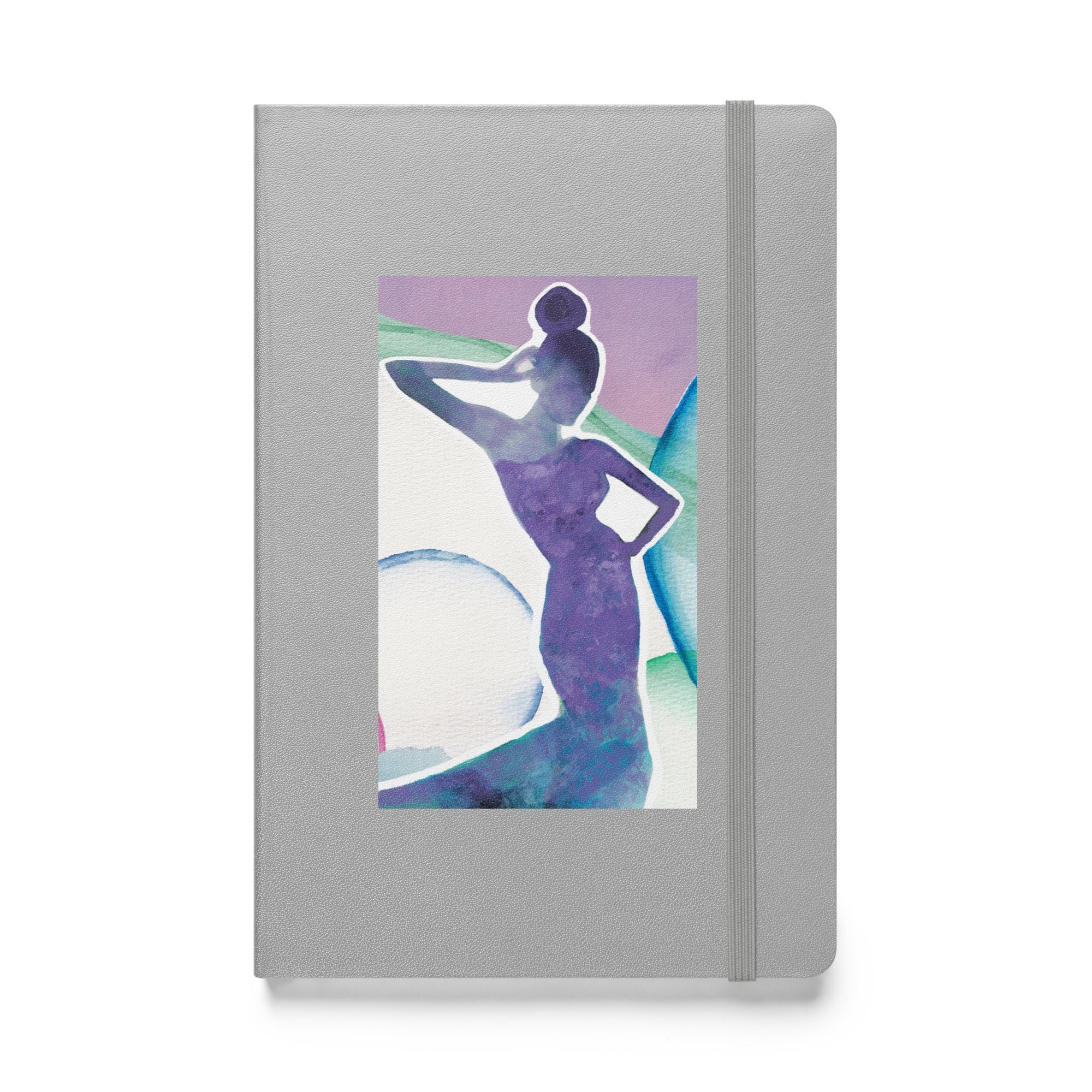 silver hardcover notebook with collage artwork on front